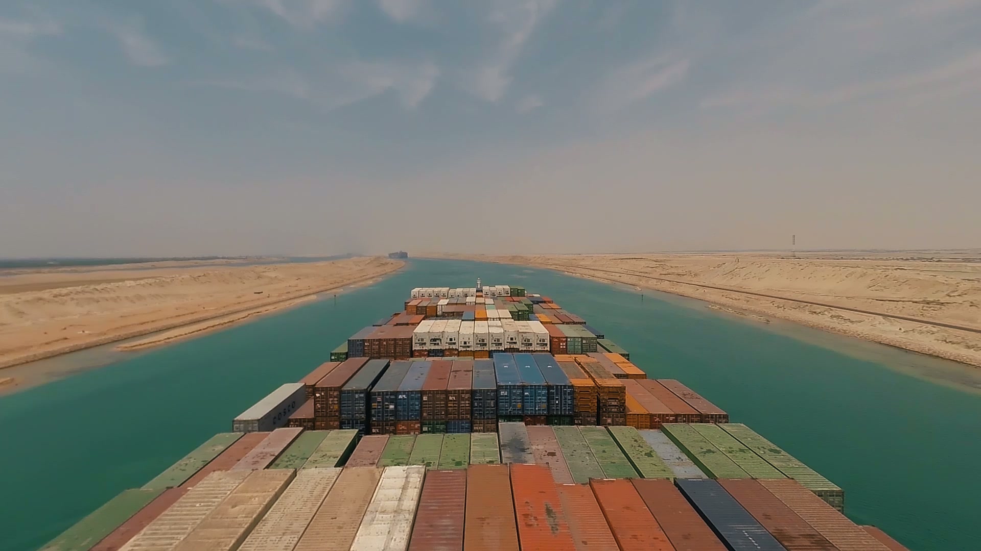 Container ship being loaded at a major port at golden hour